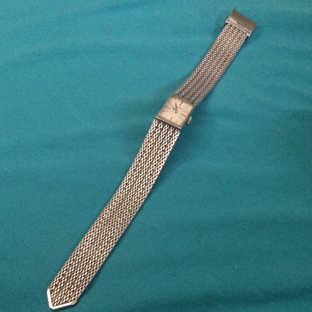 Tissot white 10k gold watch.